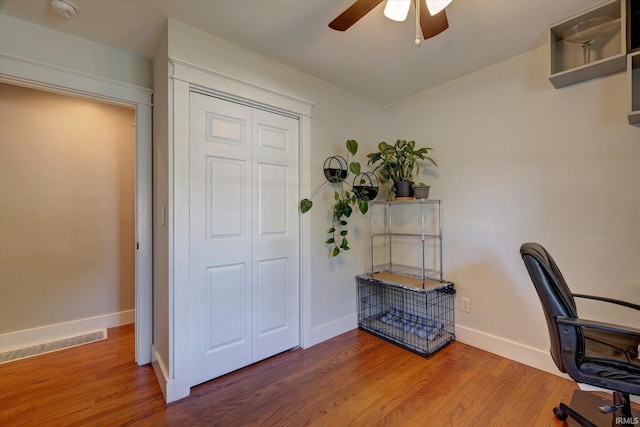 3231 N Kingsley Dr, Bloomington, IN 47404 - home office featuring ceiling fan, wood finished floors, and baseboards