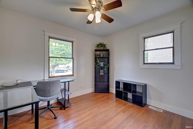 3231 N Kingsley Dr, Bloomington, IN 47404 - office area with plenty of natural light, light wood-style floors, and baseboards
