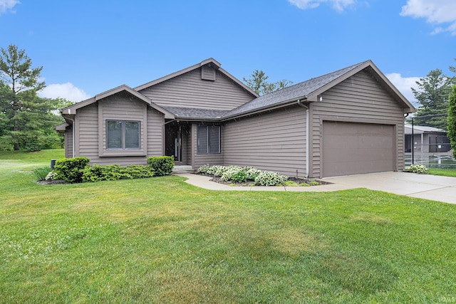 9766 Old Port Cv, Bristol, IN 46507 - ranch-style home with an attached garage, driveway, a front yard, and a shingled roof