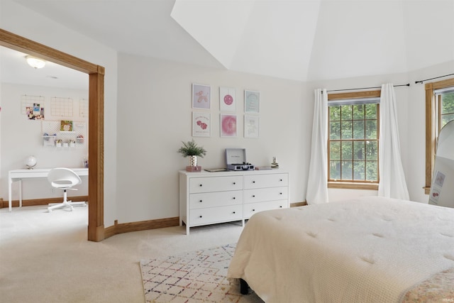 bedroom featuring light carpet, baseboards, and vaulted ceiling