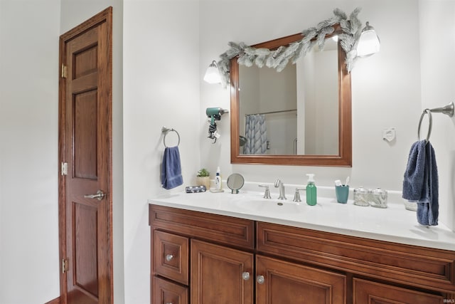 bathroom with vanity and a shower with curtain