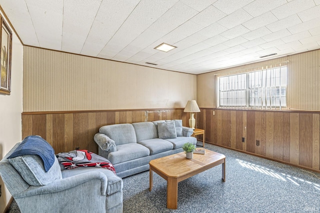 5023 Cedarwood Ln, South Bend, IN 46619 - living area with wooden walls, a wainscoted wall, and carpet floors