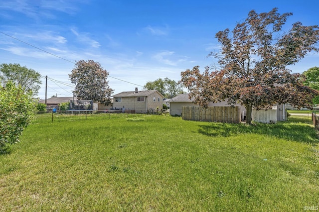 5023 Cedarwood Ln, South Bend, IN 46619 - view of yard featuring a trampoline