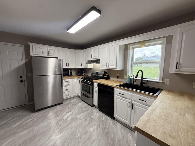 37 Ems D22A Ln, Syracuse, IN 46567 - kitchen featuring black appliances, a sink, light countertops, and white cabinets