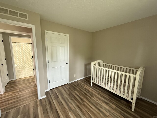 37 Ems D22A Ln, Syracuse, IN 46567 - unfurnished bedroom with dark wood-type flooring and baseboards