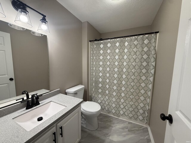 37 Ems D22A Ln, Syracuse, IN 46567 - bathroom featuring vanity, toilet, marble look tiles, a textured ceiling, and curtained shower