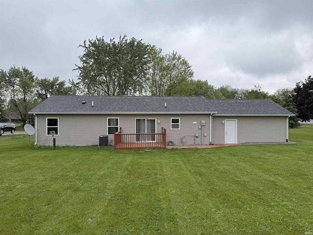 37 Ems D22A Ln, Syracuse, IN 46567 - rear view of house featuring a lawn, a deck, and central AC