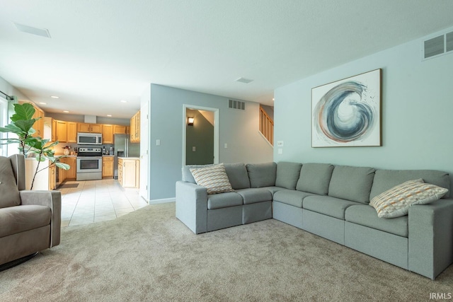 3308 S Daniel Ct, Bloomington, IN 47401 - living room featuring light carpet, stairway, and recessed lighting