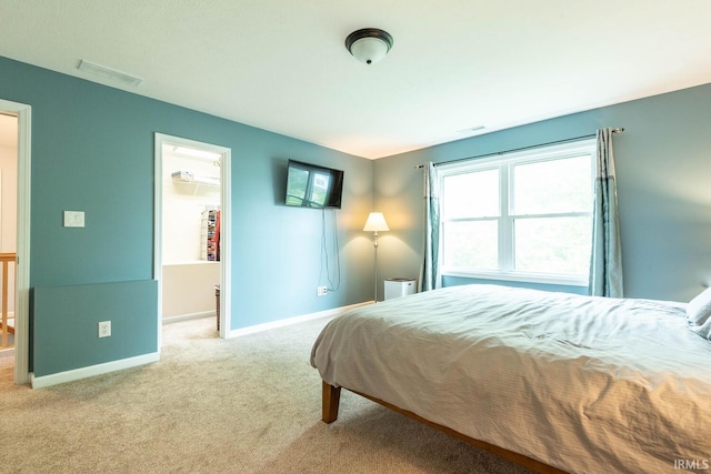 3308 S Daniel Ct, Bloomington, IN 47401 - carpeted bedroom with baseboards and a spacious closet