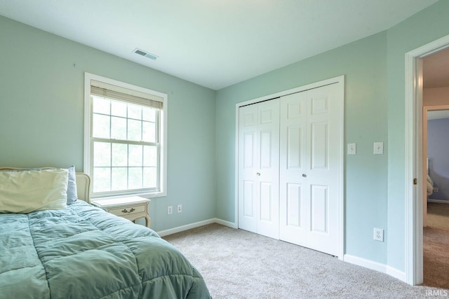3308 S Daniel Ct, Bloomington, IN 47401 - carpeted bedroom with baseboards and a closet