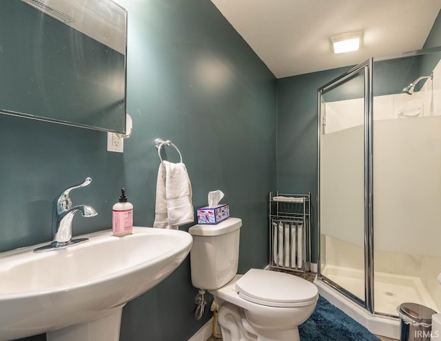 3308 S Daniel Ct, Bloomington, IN 47401 - full bathroom featuring a sink, a shower stall, and toilet