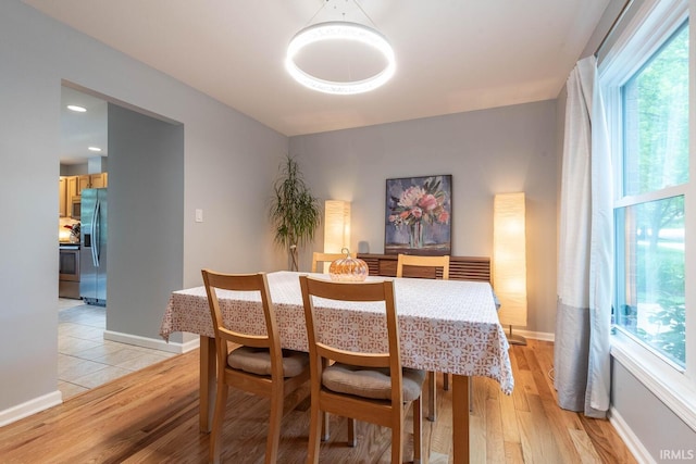 3308 S Daniel Ct, Bloomington, IN 47401 - dining space featuring light wood-style flooring, healthy amount of natural light, and baseboards