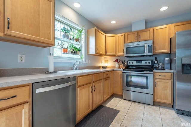 3308 S Daniel Ct, Bloomington, IN 47401 - kitchen featuring stainless steel appliances, light brown cabinets, light tile patterned flooring, light countertops, and recessed lighting