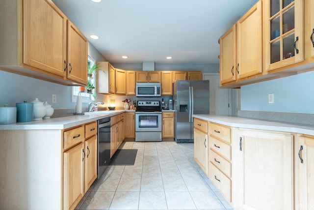 3308 S Daniel Ct, Bloomington, IN 47401 - kitchen with appliances with stainless steel finishes, a sink, light brown cabinetry, recessed lighting, and light countertops
