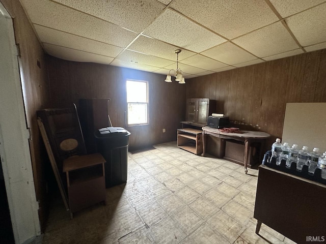 1207 Short Columbia St, Frankfort, IN 46041 - dining room featuring a paneled ceiling and wooden walls