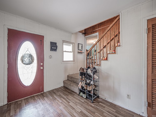 210 S E St, Oakland City, IN 47633 - foyer entrance featuring stairway, wood finished floors, and wood walls