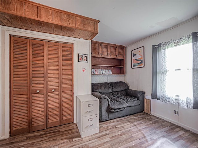 210 S E St, Oakland City, IN 47633 - living area with light wood-style flooring and baseboards