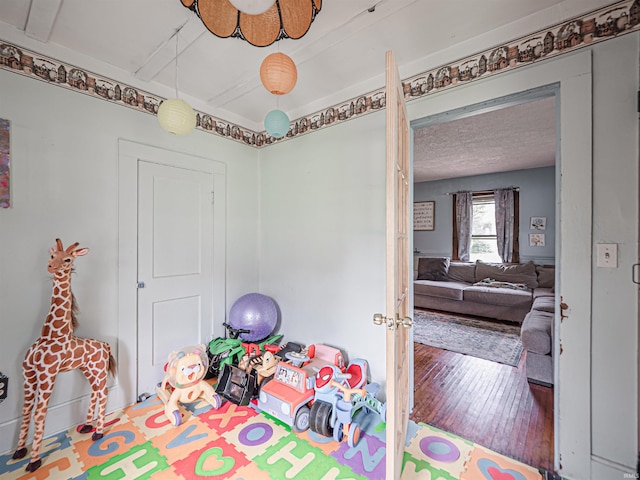 210 S E St, Oakland City, IN 47633 - playroom featuring hardwood / wood-style flooring