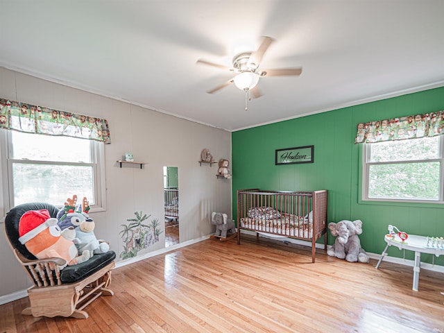 210 S E St, Oakland City, IN 47633 - bedroom featuring ornamental molding, hardwood / wood-style flooring, baseboards, and ceiling fan
