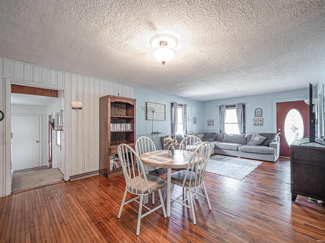 210 S E St, Oakland City, IN 47633 - dining room with a textured ceiling and hardwood / wood-style floors