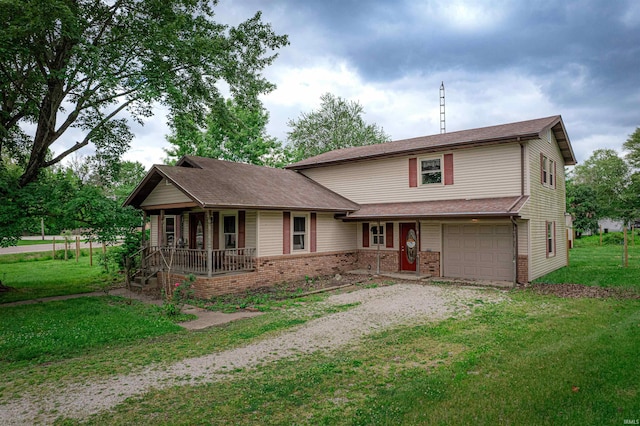 210 S E St, Oakland City, IN 47633 - traditional home featuring covered porch, driveway, an attached garage, and a front yard