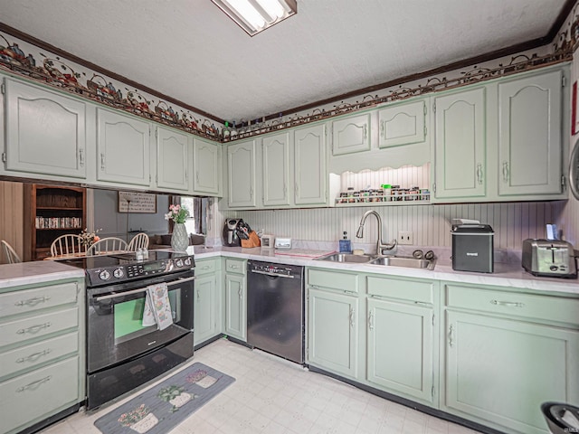 210 S E St, Oakland City, IN 47633 - kitchen with black appliances, a sink, light countertops, light floors, and a textured ceiling