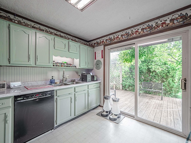 210 S E St, Oakland City, IN 47633 - kitchen featuring black dishwasher, a sink, light flooring, a textured ceiling, and light countertops