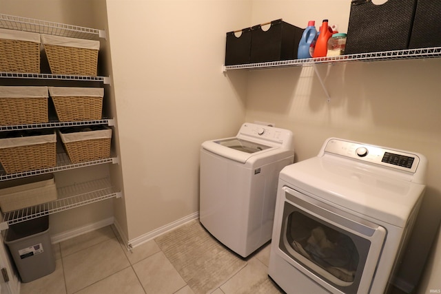 3244 Ashdon Dr, Newburgh, IN 47630 - laundry area with separate washer and dryer, baseboards, and light tile patterned floors