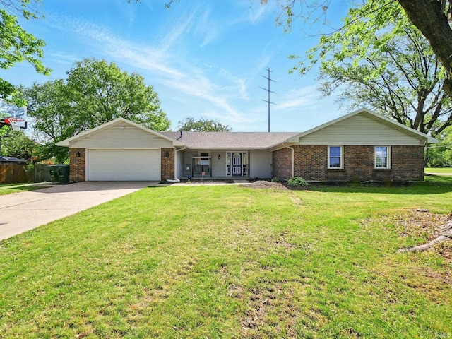 5200 N Leslie Dr, Muncie, IN 47304 - ranch-style home featuring a garage, brick siding, driveway, and a front lawn