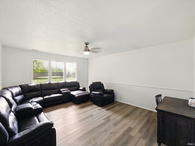 5200 N Leslie Dr, Muncie, IN 47304 - living area with a ceiling fan, wood finished floors, and a textured ceiling
