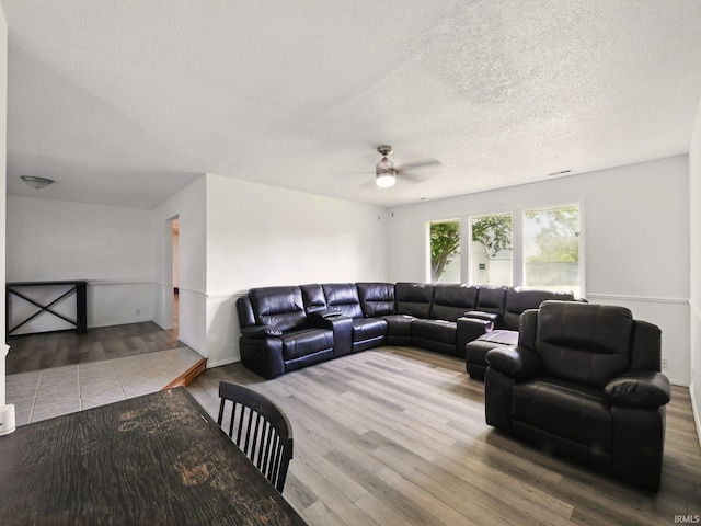 5200 N Leslie Dr, Muncie, IN 47304 - living area with wood finished floors, a ceiling fan, and a textured ceiling