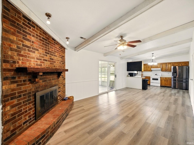 5200 N Leslie Dr, Muncie, IN 47304 - unfurnished living room with a fireplace, light wood-type flooring, ceiling fan, and wainscoting