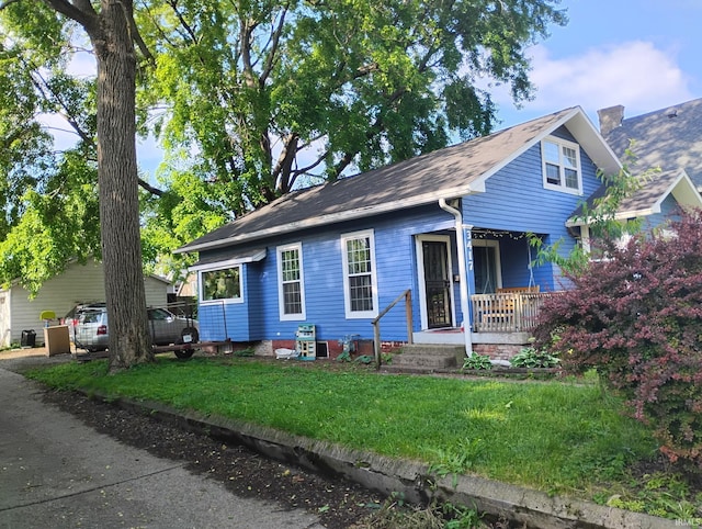 3417 Parkway S Dr, Indianapolis, IN 46201 - view of front of home featuring a porch and a front yard