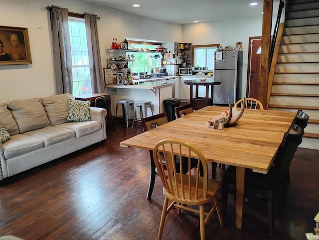 3417 Parkway S Dr, Indianapolis, IN 46201 - dining area with plenty of natural light, dark wood-type flooring, stairs, and recessed lighting