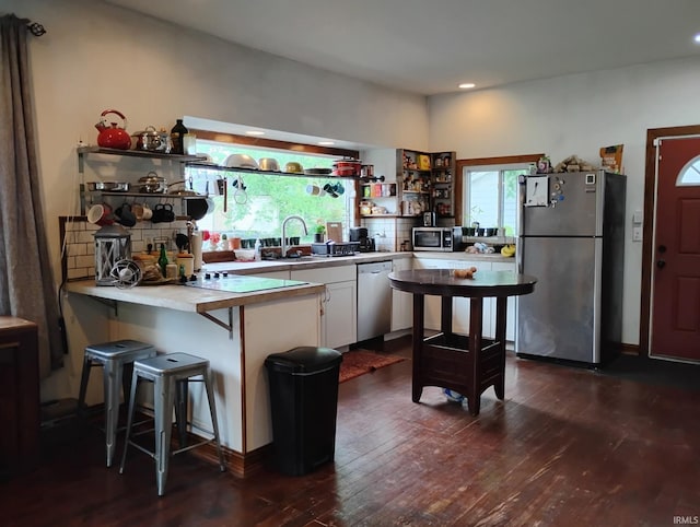 3417 Parkway S Dr, Indianapolis, IN 46201 - kitchen featuring appliances with stainless steel finishes, open shelves, white cabinetry, dark wood-style floors, and recessed lighting