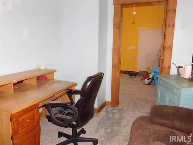 225 N Parker Ave, Albany, IN 47320 - office area featuring light carpet and baseboards