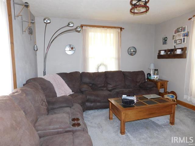 225 N Parker Ave, Albany, IN 47320 - living room featuring carpet