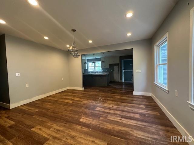 401 E Sycamore St, Converse, IN 46919 - unfurnished dining area featuring dark wood-style floors, recessed lighting, and baseboards