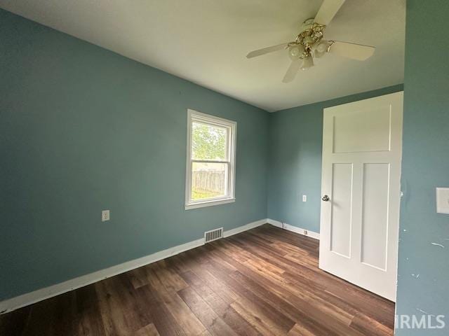 401 E Sycamore St, Converse, IN 46919 - spare room with dark wood-type flooring, baseboards, and ceiling fan