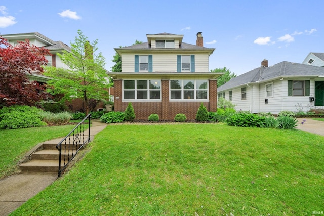 214 Tonti St, South Bend, IN 46617 - traditional style home featuring a front yard, brick siding, and a chimney