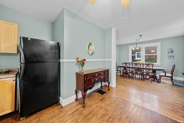214 Tonti St, South Bend, IN 46617 - kitchen featuring freestanding refrigerator, light wood-type flooring, baseboards, ceiling fan, and light brown cabinets