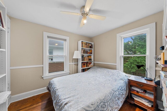 214 Tonti St, South Bend, IN 46617 - bedroom featuring dark wood finished floors, baseboards, and a ceiling fan