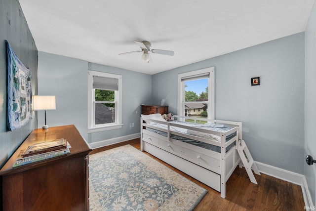 214 Tonti St, South Bend, IN 46617 - bedroom with baseboards, wood finished floors, and a ceiling fan