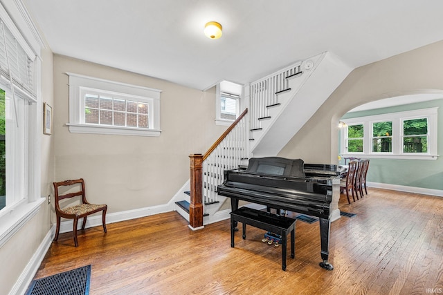 214 Tonti St, South Bend, IN 46617 - living area with wood finished floors, healthy amount of natural light, and stairs