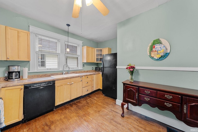 214 Tonti St, South Bend, IN 46617 - kitchen featuring black appliances, a sink, light brown cabinets, and ceiling fan
