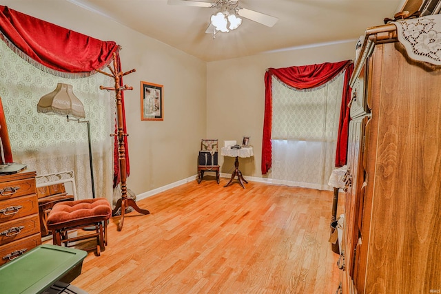 1402 Tanager Dr, Warsaw, IN 46580 - interior space with wood finished floors, a ceiling fan, and baseboards