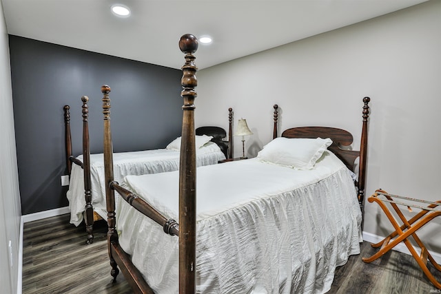 1402 Tanager Dr, Warsaw, IN 46580 - bedroom with wood finished floors, baseboards, and recessed lighting