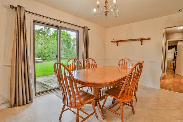 1402 Tanager Dr, Warsaw, IN 46580 - dining space featuring a chandelier, light floors, and baseboards
