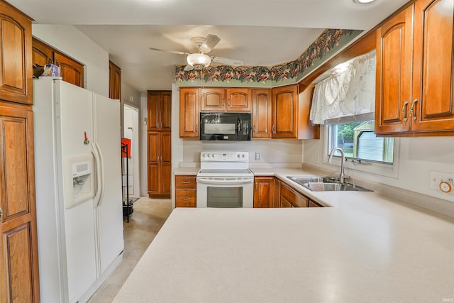 1402 Tanager Dr, Warsaw, IN 46580 - kitchen with white appliances, a sink, ceiling fan, brown cabinets, and light countertops