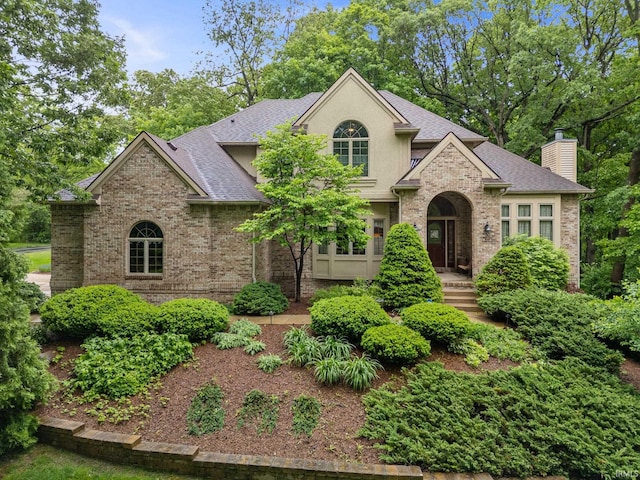 4705 Haven Ct, West Lafayette, IN 47906 - traditional-style house with a shingled roof, brick siding, and a chimney